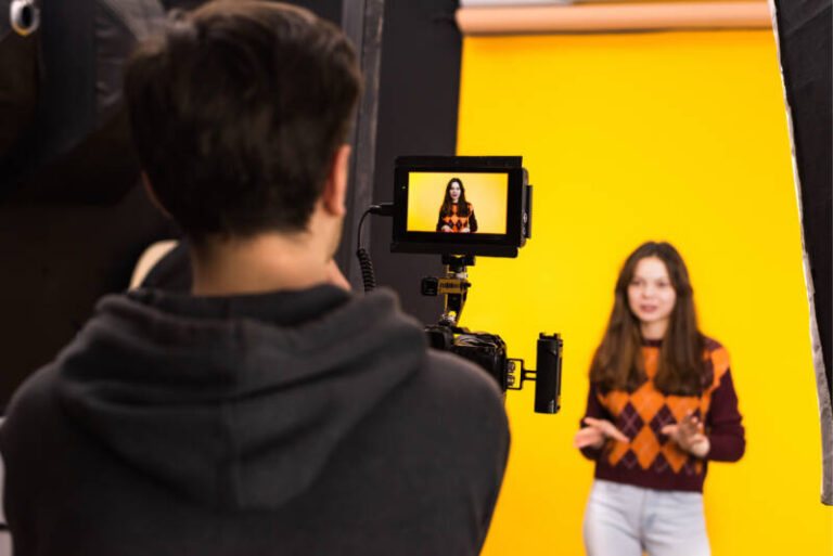 professional photographer shooting young woman 1